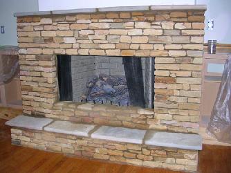 natural stacked stone with stone hearth and mantle