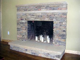 natural stacked stone fireplace with sandstone hearth