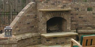 brick fireplace with privacy wall and bench