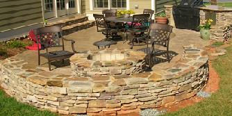 stone fire pit with sitting bench