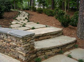 natural stone steps with wall and stepping stones