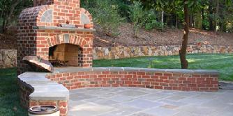 brick fireplace with bluestone patio and accents