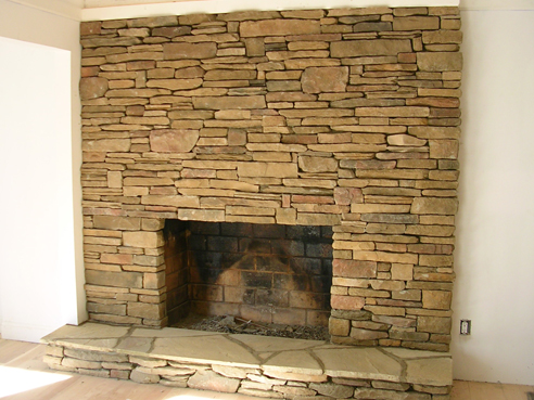 cultured stone floor to celing fireplace
