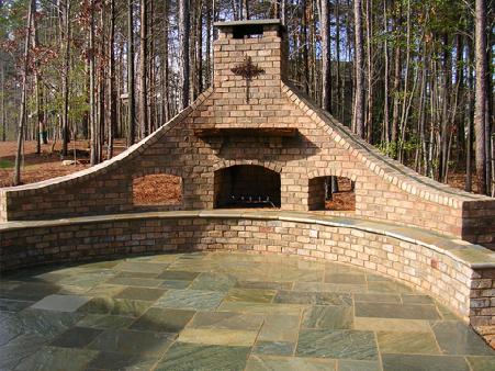 brick fireplace with asian bluestone benches and accents
