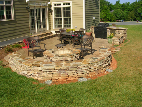 outdoor living area with gas starting fire pit